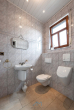 EG Gäste WC - Beeindruckende Raumhöhe und optionale Einliegerwohnung. Stilvolles Architektenhaus in Grolsheim.