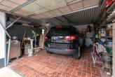 Garage - Stilvolles Wohnhaus in Grolsheim mit großzügiger Raumhöhe und Einliegeroption